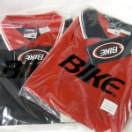 2 XL Red and black Golf Shirts, 6 XL Black and Red golf shirts; $2 each